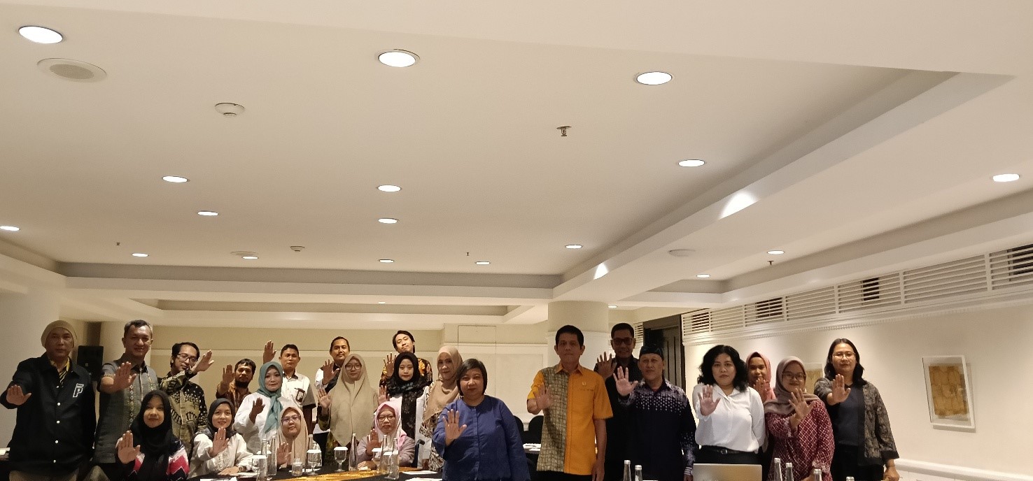 A group of people standing in a roomAI-generated content may be incorrect., Picture
